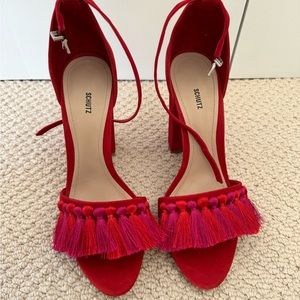 Schutz Red Tassel heels, perfect for dressing up any outfit!